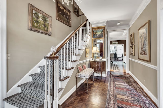 stairway featuring ornamental molding and parquet floors