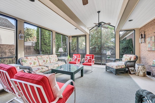 sunroom / solarium with a wealth of natural light, ceiling fan, and wood ceiling