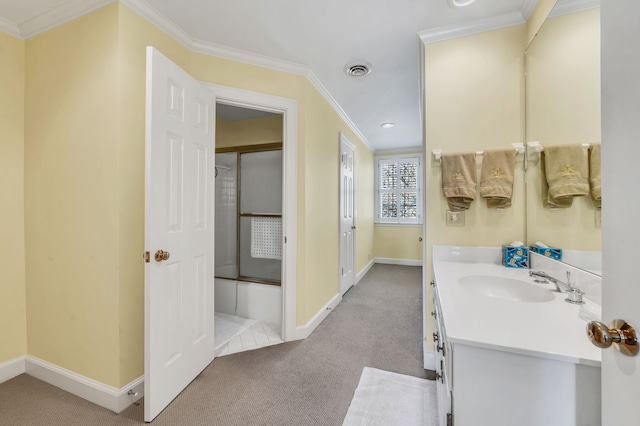 bathroom featuring shower / bath combination with glass door, vanity, and ornamental molding