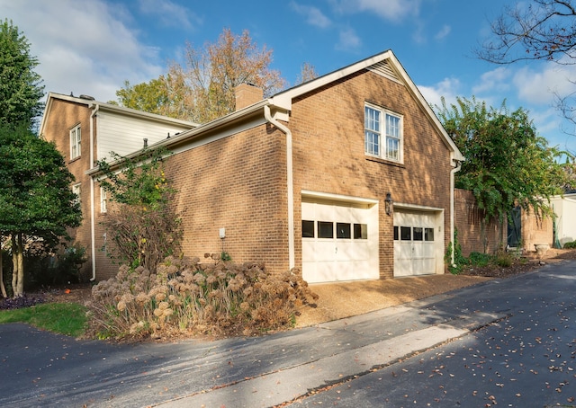 view of property exterior with a garage