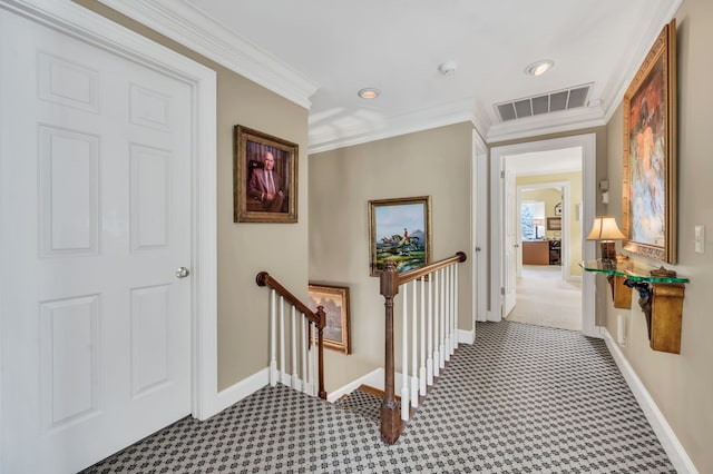 hall featuring carpet floors and ornamental molding