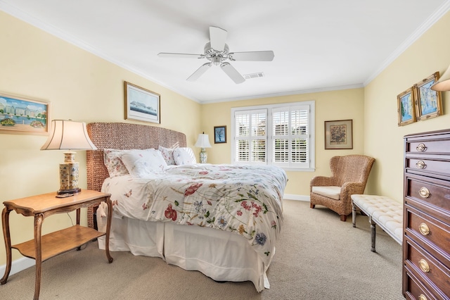 carpeted bedroom featuring ornamental molding and ceiling fan