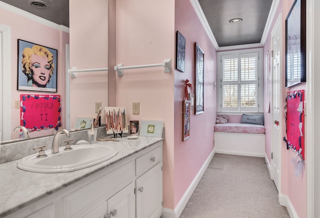 bathroom with vanity and crown molding