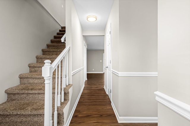 stairs with hardwood / wood-style flooring