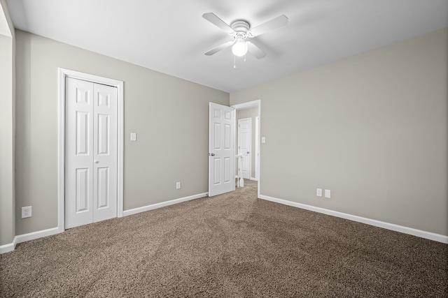 unfurnished bedroom with carpet flooring, ceiling fan, and a closet