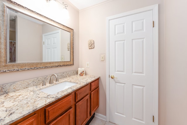 bathroom featuring vanity, tile patterned flooring, and ornamental molding