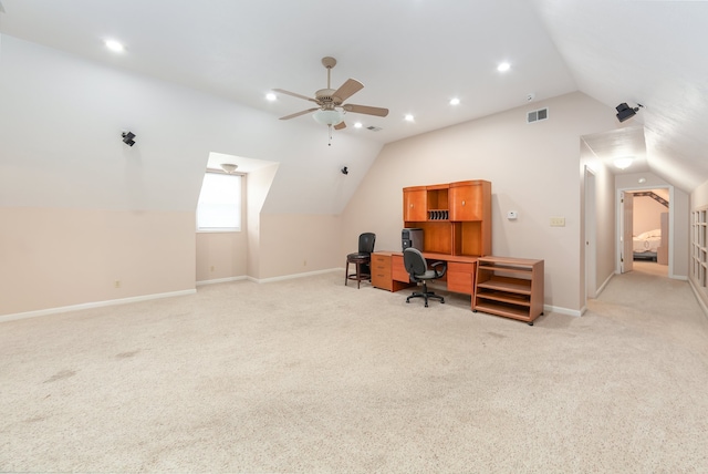 carpeted home office with lofted ceiling and ceiling fan