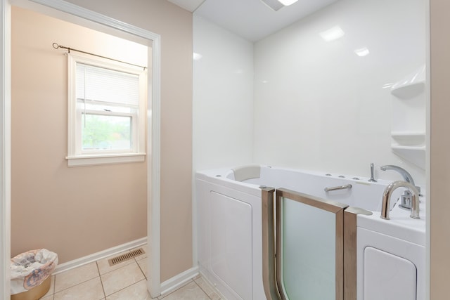 washroom featuring light tile patterned flooring