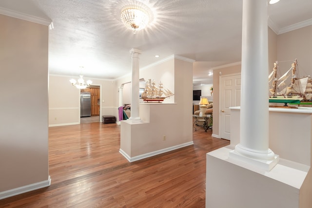 corridor featuring hardwood / wood-style floors and crown molding