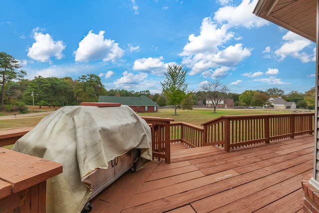 wooden terrace with a yard