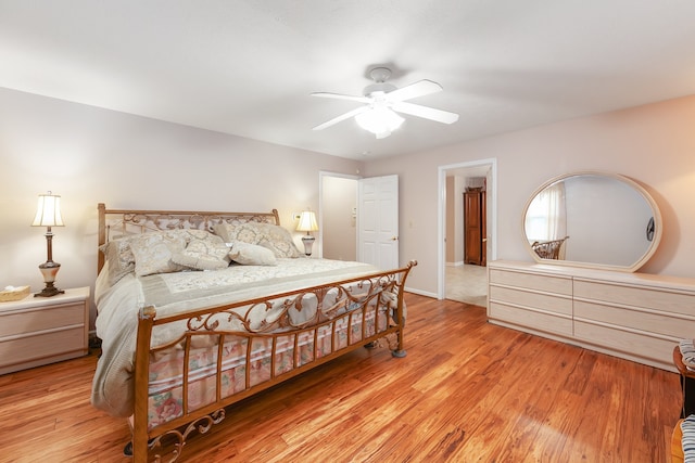 bedroom featuring light hardwood / wood-style flooring and ceiling fan