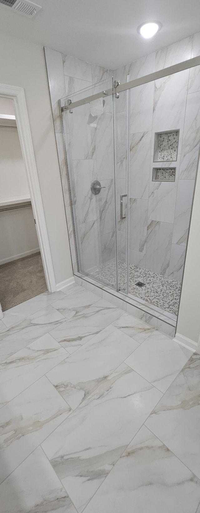 bathroom featuring walk in shower