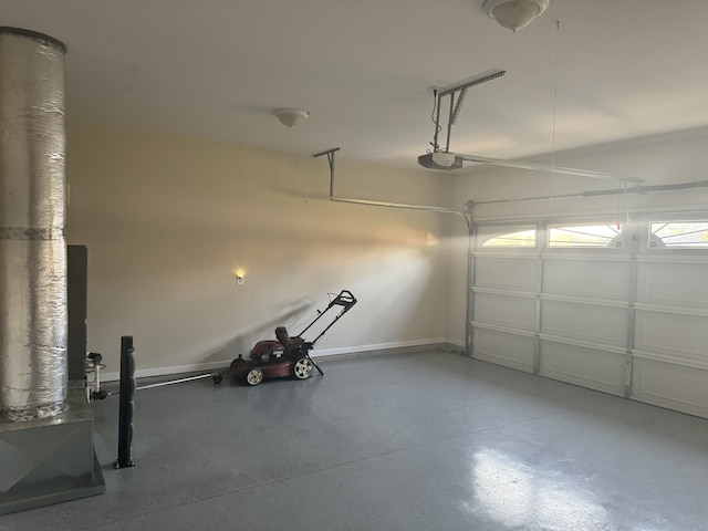 garage with baseboards and a garage door opener