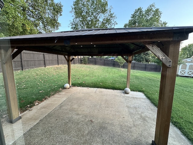 exterior space with a storage shed, a gazebo, and a fenced backyard