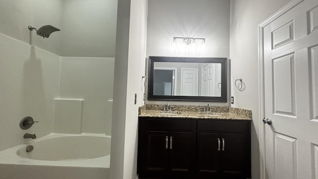 bathroom with double vanity, a sink, and bathing tub / shower combination