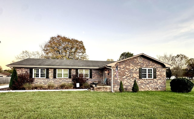 ranch-style house with a yard