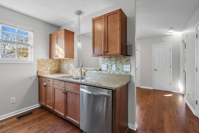 kitchen featuring decorative light fixtures, tasteful backsplash, sink, dark hardwood / wood-style flooring, and stainless steel dishwasher