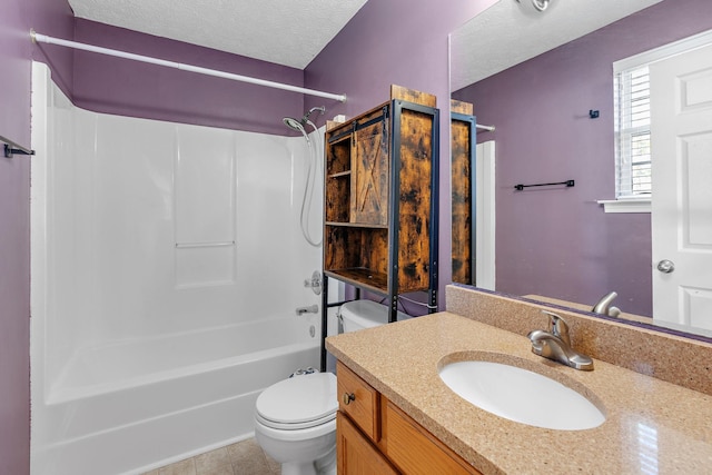 full bathroom featuring bathing tub / shower combination, vanity, a textured ceiling, tile patterned floors, and toilet