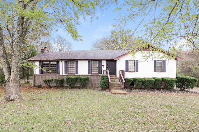 ranch-style house featuring a front lawn