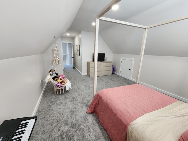 bedroom with carpet floors and vaulted ceiling