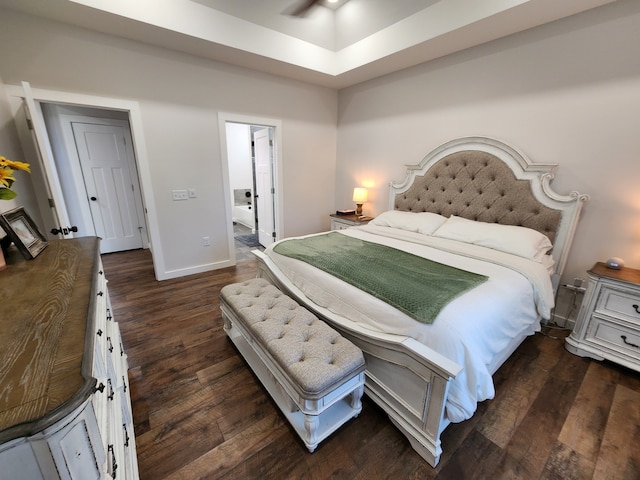 bedroom with ceiling fan and dark hardwood / wood-style flooring