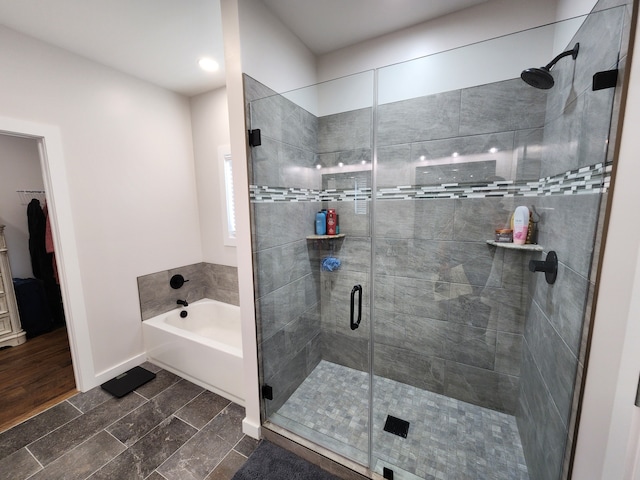 bathroom featuring plus walk in shower