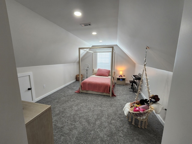 bedroom featuring dark carpet and vaulted ceiling