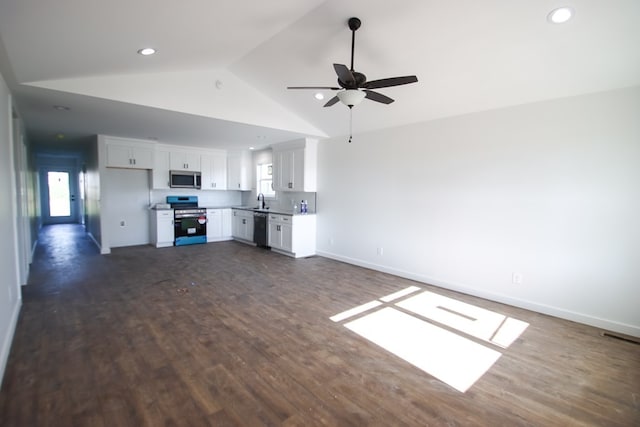 unfurnished living room with lofted ceiling, ceiling fan, dark wood-type flooring, and sink