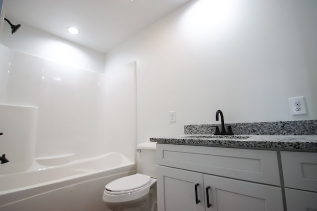 full bathroom with bathing tub / shower combination, vanity, and toilet