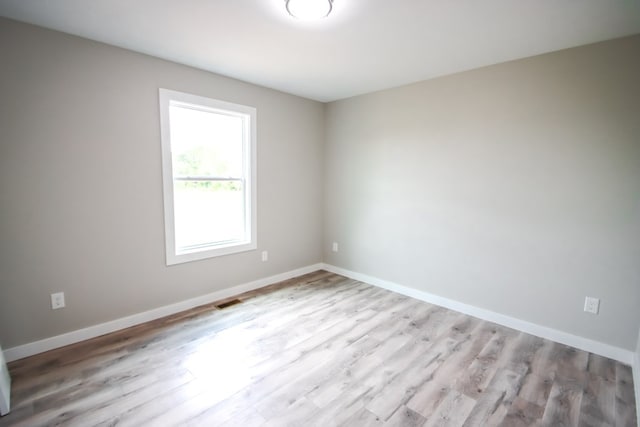 unfurnished room featuring light hardwood / wood-style floors