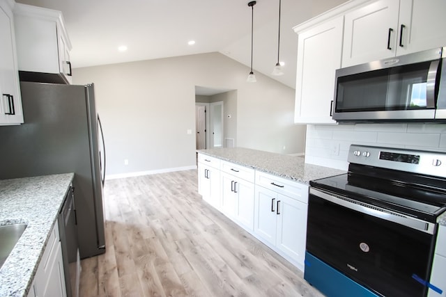 kitchen with white cabinetry, hanging light fixtures, lofted ceiling, stainless steel appliances, and light stone counters