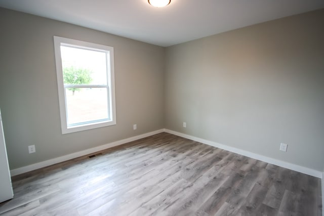 unfurnished room featuring light wood-type flooring