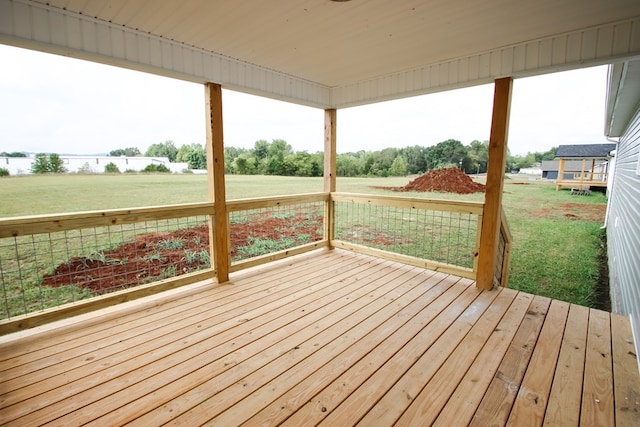 wooden deck with a yard