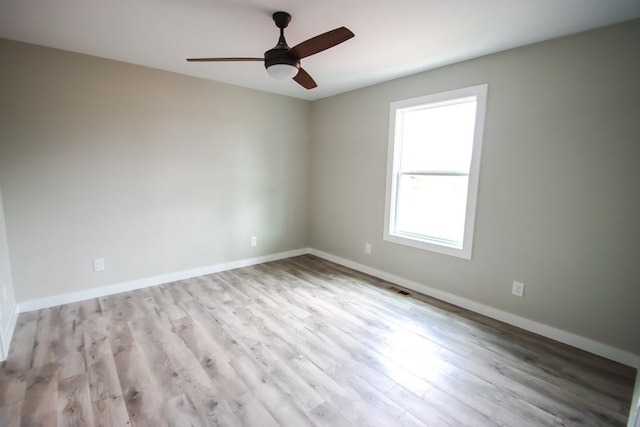 spare room featuring ceiling fan and light wood-type flooring