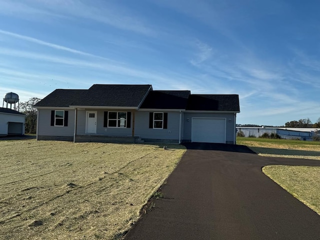 ranch-style home with a front yard and a garage