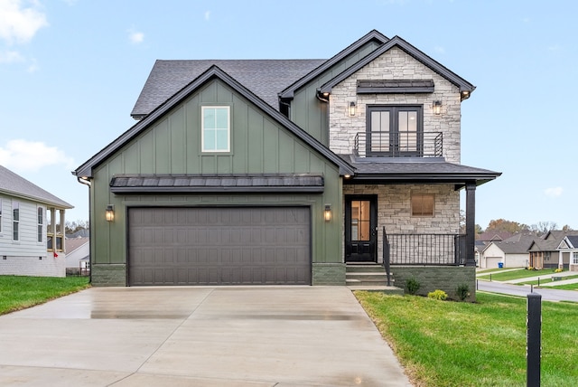 view of front of house with covered porch, french doors, and a front yard