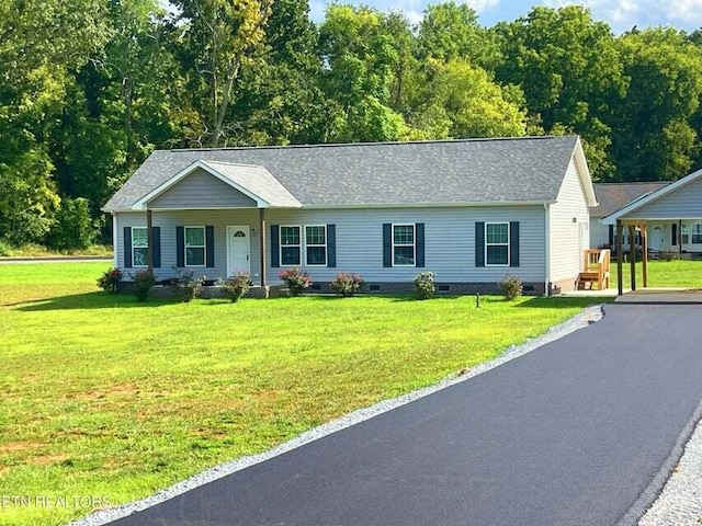 ranch-style house featuring a front yard