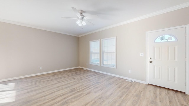 entrance foyer featuring light hardwood / wood-style floors, crown molding, ceiling fan, and a healthy amount of sunlight