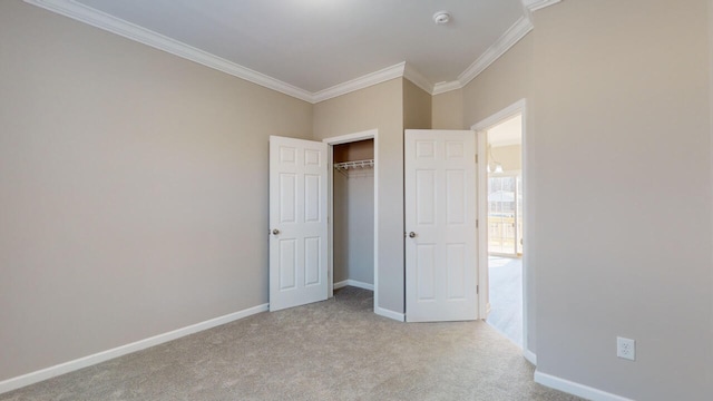 unfurnished bedroom with light carpet, a closet, and ornamental molding