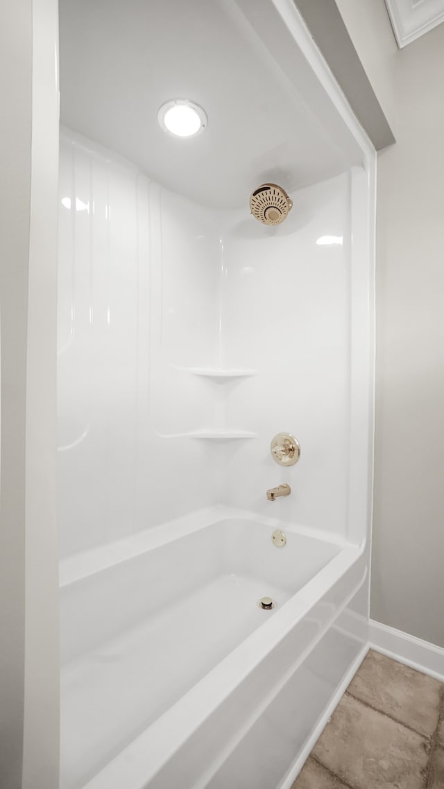 bathroom with bathing tub / shower combination and tile patterned floors