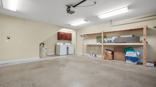 garage with separate washer and dryer, a garage door opener, and water heater