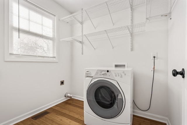 laundry room with washer / dryer and hardwood / wood-style floors