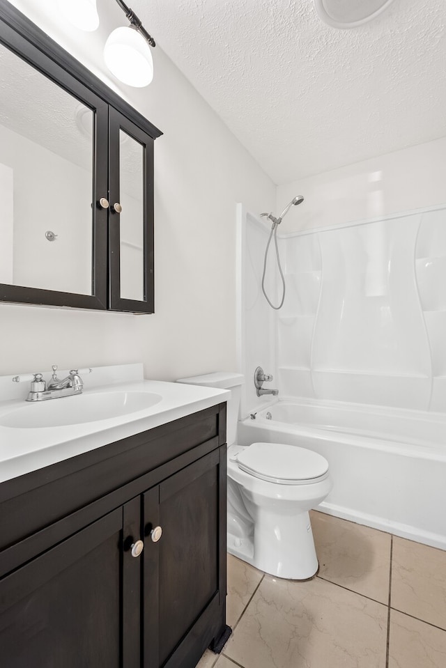 full bathroom featuring vanity, a textured ceiling, shower / bathing tub combination, tile patterned flooring, and toilet