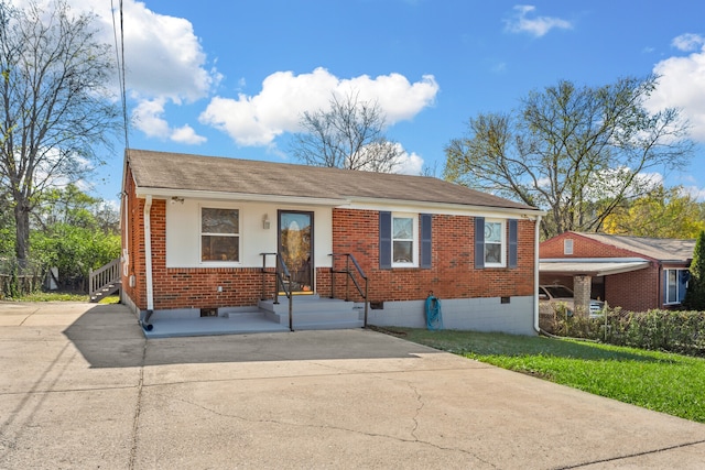 view of front of home featuring a carport