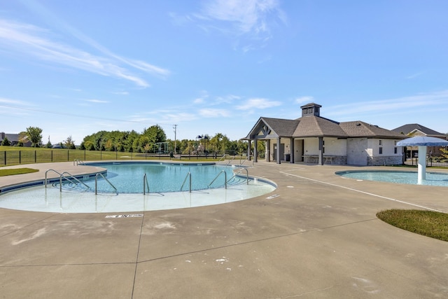 view of pool featuring a patio area