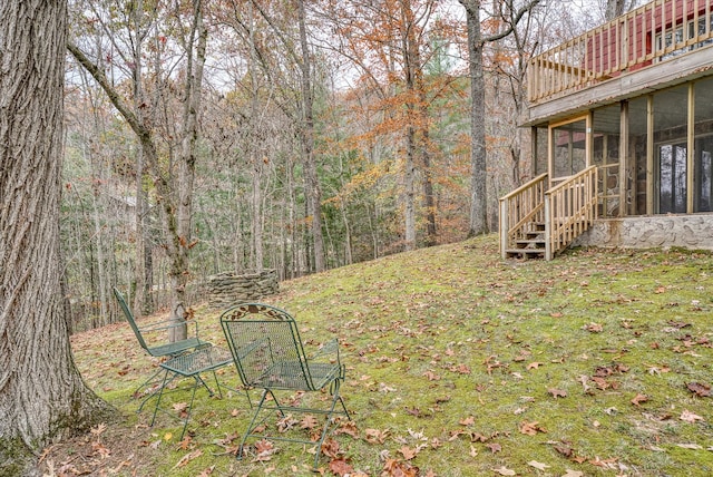 view of yard featuring a sunroom