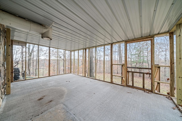 unfurnished sunroom featuring plenty of natural light