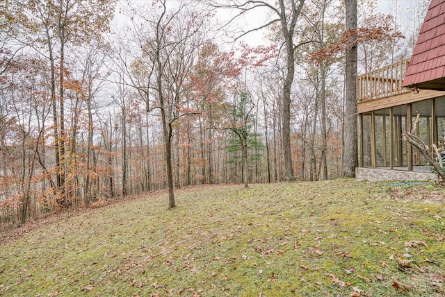 view of yard with a sunroom