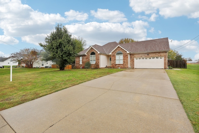 ranch-style home featuring a front lawn and a garage