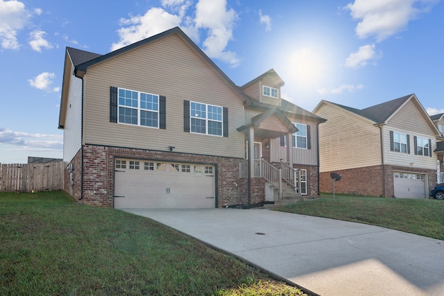 view of front of house featuring a garage and a front yard